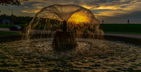 Fountain in front of sunset