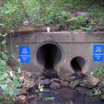 Stormwater drain outlets in a wall