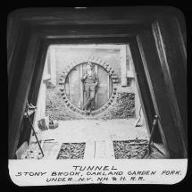 A man standing in a new Stony Brook drainage tunnel