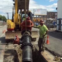 A work crew installing a new water main pipe