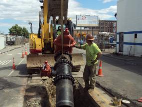 A work crew installing a new water main pipe